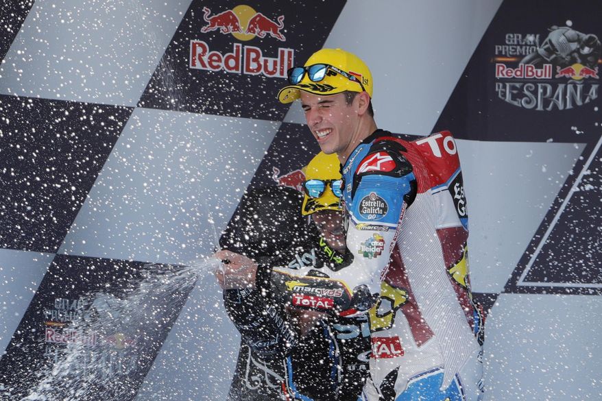 Moto2 rider Alex Marquez of Spain celebrates his win on the podium at the Spanish Motorcycle Grand Prix at the Jerez racetrack in Jerez de la Frontera, Spain, Sunday, May 7, 2017. (AP Photo/Miguel Morenatti)