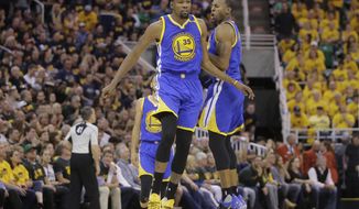 Golden State Warriors&#x27; Andre Iguodala, right, celebrates with Kevin Durant (35) after he scores against the Utah Jazz in the second half during Game 3 of the NBA basketball second-round playoff series Saturday, May 6, 2017, in Salt Lake City.  (AP Photo/Rick Bowmer)