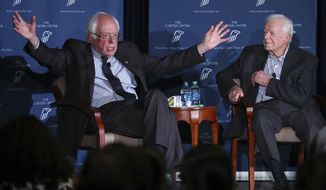 Former President Jimmy Carter, right, and Sen. Bernie Sanders discuss human rights during the Human Rights Defenders Forum at the Carter Center in Atlanta on Monday, May 8, 2017. (Curtis Compton/Atlanta Journal-Constitution via AP)