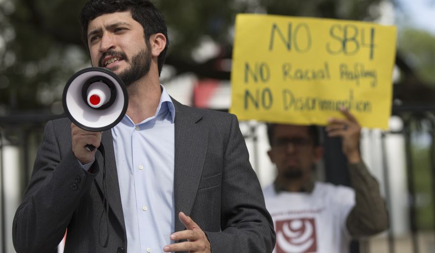 Gregorio Casar speaks during a protest outside of the Texas Governor&#39;s Mansion in Austin, Texas, Monday, May 8, 2017. The gathering was to protest Texas&#39; new &quot;sanctuary cities&quot; law, which takes effect in September and which critics say is the most anti-immigrant since a 2010 Arizona law, that will allow police officers to ask about the immigration status of anyone they detain, including during routine traffic stops. Republican Gov. Greg Abbott signed the law Sunday evening on Facebook Live with no advanced warning. (Ricardo B. Brazziell/Austin American-Statesman via AP)