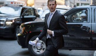 FILE - In this Jan. 6, 2017 file photo, Eric Trump, son of President-elect Donald Trump departs from Trump Tower in New York. President Donald Trump&#39;s son denied Monday, May 8, 2017, that he told a sportswriter that the family’s real estate business got money from Russia to fund golf courses.  (AP Photo/Andrew Harnik, File)