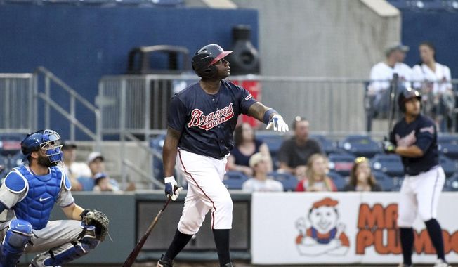 In this photo taken Wednesday, May 3, 2017, and provided by the Gwinnett Braves, Gwinnett Braves&#x27; Ryan Howard watches his two-run home run during the fourth inning of a minor league baseball game against the Durham Bulls in Gwinnett, Ga. Howard is an MVP, a World Series champion and once one of baseball&#x27;s most feared sluggers. So what&#x27;s he doing in the minor leagues at age 37? &amp;quot;I&#x27;ve still got something in the tank,&amp;quot; he says. (Jim Lacey/Gwinnett Braves via AP)