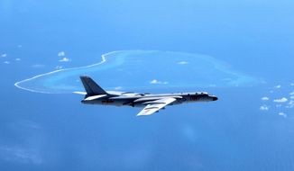 In this undated photo released by Xinhua News Agency, a Chinese H-6K bomber patrols the islands and reefs in the South China Sea. China’s state broadcaster showed on Sunday, May 7, 2017, navy fighter bombers taking part in exercises over the South China Sea, including one involving the detection and expulsion of foreign military surveillance aircraft such as those deployed regularly in the area by the U.S. and others. The video shown on CCTV’s military channel shows a squadron of two-seater Xian JH-7 Flying Leopards flying in formation and dropping bombs on targets in the ocean below. (Liu Rui/Xinhua via AP, File)