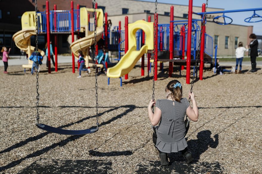 In this Wednesday, March 29, 2017 photo, students play during an after-school program at Circleville Elementary School, in Circleville, Ohio. Circleville school officials said it would be very difficult to keep their after-school programs going if federal funding for the 21st Century Community Learning Centers program is eliminated as proposed by President Donald Trump's administration. (AP Photo/John Minchillo)