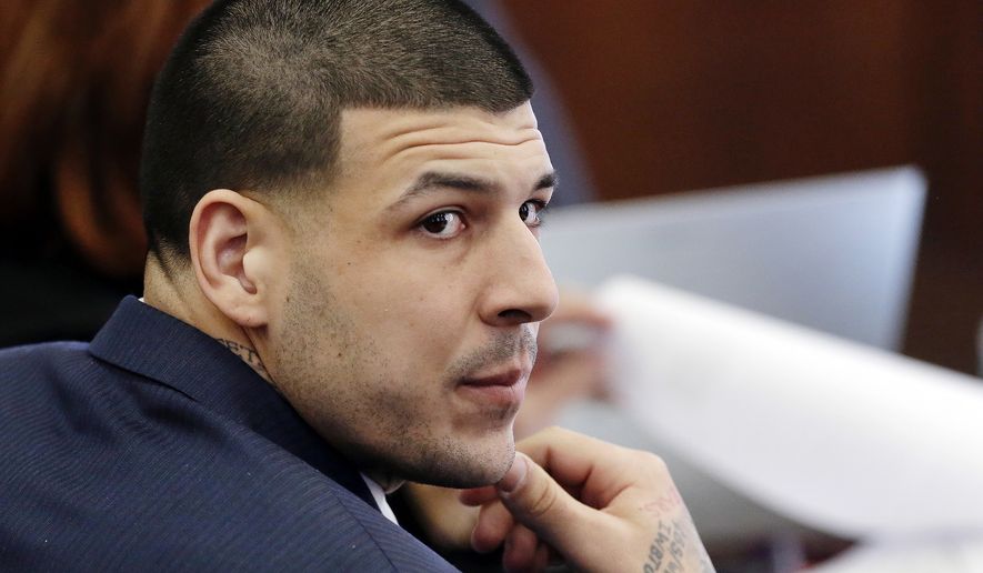 FILE - In this March 15, 2017, file photo, Defendant Aaron Hernandez listens during his double murder trial in Suffolk Superior Court, in Boston. A judge is set to hear arguments in a push by lawyers for former NFL star Aaron Hernandez to erase his conviction in a 2013 murder. The former New England Patriots tight end hanged himself in his prison cell April 19 while serving a life sentence in the killing of semi-professional football player Odin Lloyd. (AP Photo/Elise Amendola, Pool, File) **FILE**