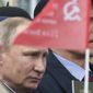 Russian President Vladimir Putin participated in the Immortal Regiment march at the Red Square in Moscow on Tuesday to mark 72 years since the end of World War II and the Soviet defeat of Nazi Germany. (Associated Press)