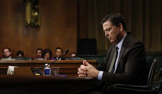 In this Wednesday, May 3, 2017, photo then-FBI Director James Comey pauses as he testifies on Capitol Hill in Washington, before a Senate Judiciary Committee hearing. President Donald Trump abruptly fired Comey on May 9, ousting the nation&#x27;s top law enforcement official in the midst of an investigation into whether Trump&#x27;s campaign had ties to Russia&#x27;s election meddling.(AP Photo/Carolyn Kaster)