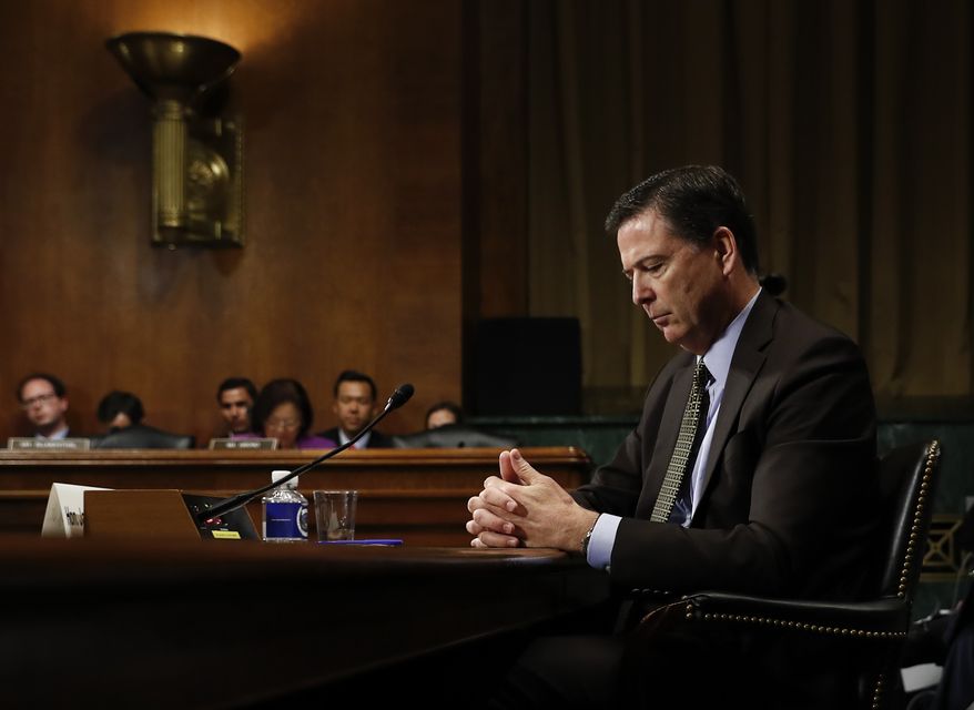 In this Wednesday, May 3, 2017, photo then-FBI Director James Comey pauses as he testifies on Capitol Hill in Washington, before a Senate Judiciary Committee hearing. President Donald Trump abruptly fired Comey on May 9, ousting the nation&#39;s top law enforcement official in the midst of an investigation into whether Trump&#39;s campaign had ties to Russia&#39;s election meddling.(AP Photo/Carolyn Kaster)
