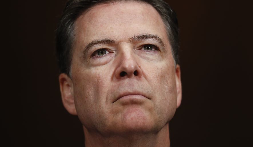In this Wednesday, May 3, 2017, photo, then-FBI Director James Comey pauses as he testifies on Capitol Hill in Washington, before a Senate Judiciary Committee hearing. President Donald Trump abruptly fired Comey on May 9, ousting the nation&#39;s top law enforcement official in the midst of an investigation into whether Trump&#39;s campaign had ties to Russia&#39;s election meddling.(AP Photo/Carolyn Kaster)