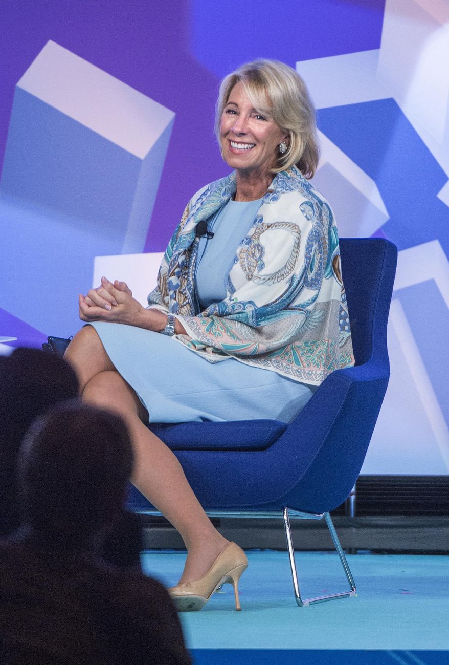 U.S. Department of Education Secretary Betsy DeVos reacts as she speaks to the crowd at the ASU + GSV Summit at the Grand America Hotel in Salt Lake City, Tuesday, May 9, 2017. DeVos is reiterating her push for school choice during an annual education technology conference, comparing the issue to being able to switch between phone service providers. (Leah Hogsten/The Salt Lake Tribune via AP)