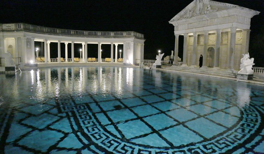 FILE - This Dec. 5, 2013, file photo, shows the Neptune Pool on the grounds of Hearst Castle, the former home of publishing magnate William Randolph Hearst, in San Simeon, Calif. Visitors to Hearst Castle on the central California coast should be able to see its extravagant Neptune Pool full of water this year. Restoration of the 345,000-gallon pool should be complete by late summer or fall. The pool was drained in 2014 and repairs have been underway for more than a year. (AP Photo/Reed Saxon,File)