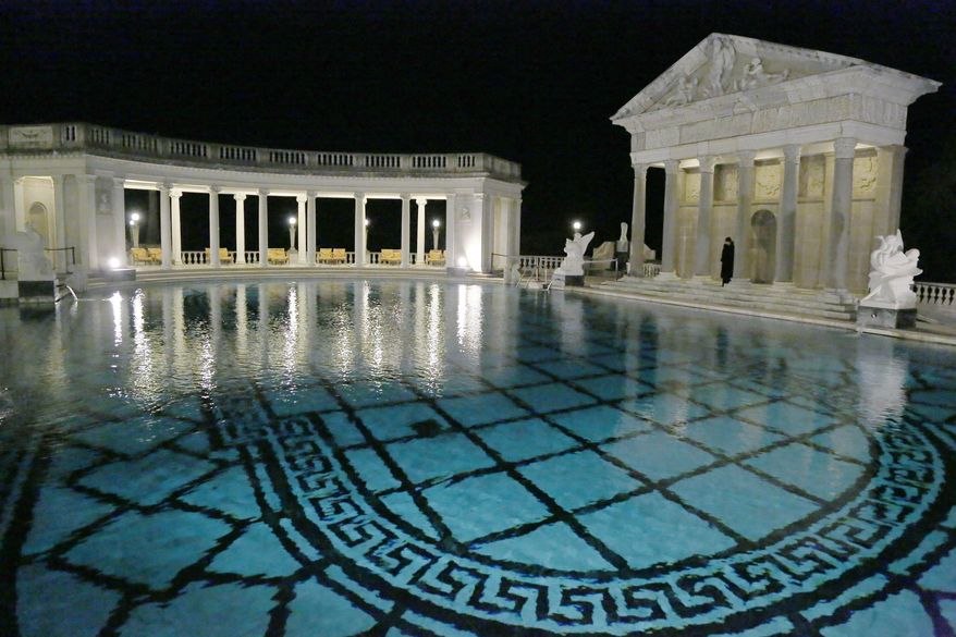 FILE - This Dec. 5, 2013, file photo, shows the Neptune Pool on the grounds of Hearst Castle, the former home of publishing magnate William Randolph Hearst, in San Simeon, Calif. Visitors to Hearst Castle on the central California coast should be able to see its extravagant Neptune Pool full of water this year. Restoration of the 345,000-gallon pool should be complete by late summer or fall. The pool was drained in 2014 and repairs have been underway for more than a year. (AP Photo/Reed Saxon,File)