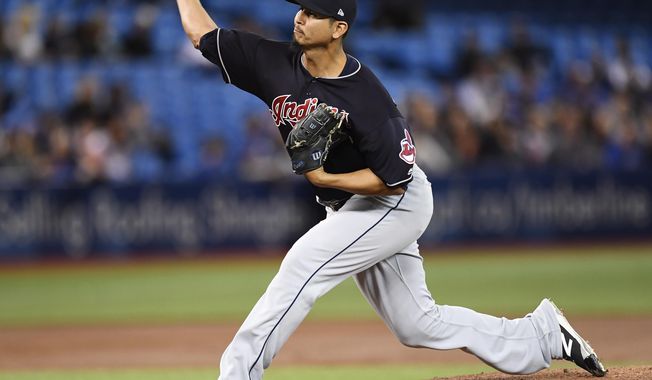 Cleveland Indians starting pitcher Carlos Carrasco throws against the Toronto Blue Jays during the first inning of a baseball game Tuesday, May 9, 2017, in Toronto. (Frank Gunn/The Canadian Press via AP)