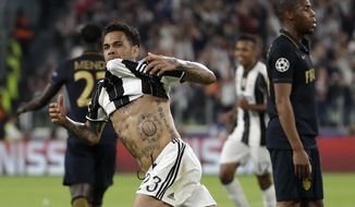 Juventus&#39; Dani Alves celebrates after scoring his side&#39;s second goal during the Champions League semi final second leg soccer match between Juventus and Monaco in Turin, Italy, Tuesday, May 9, 2017. (AP Photo/Luca Bruno)
