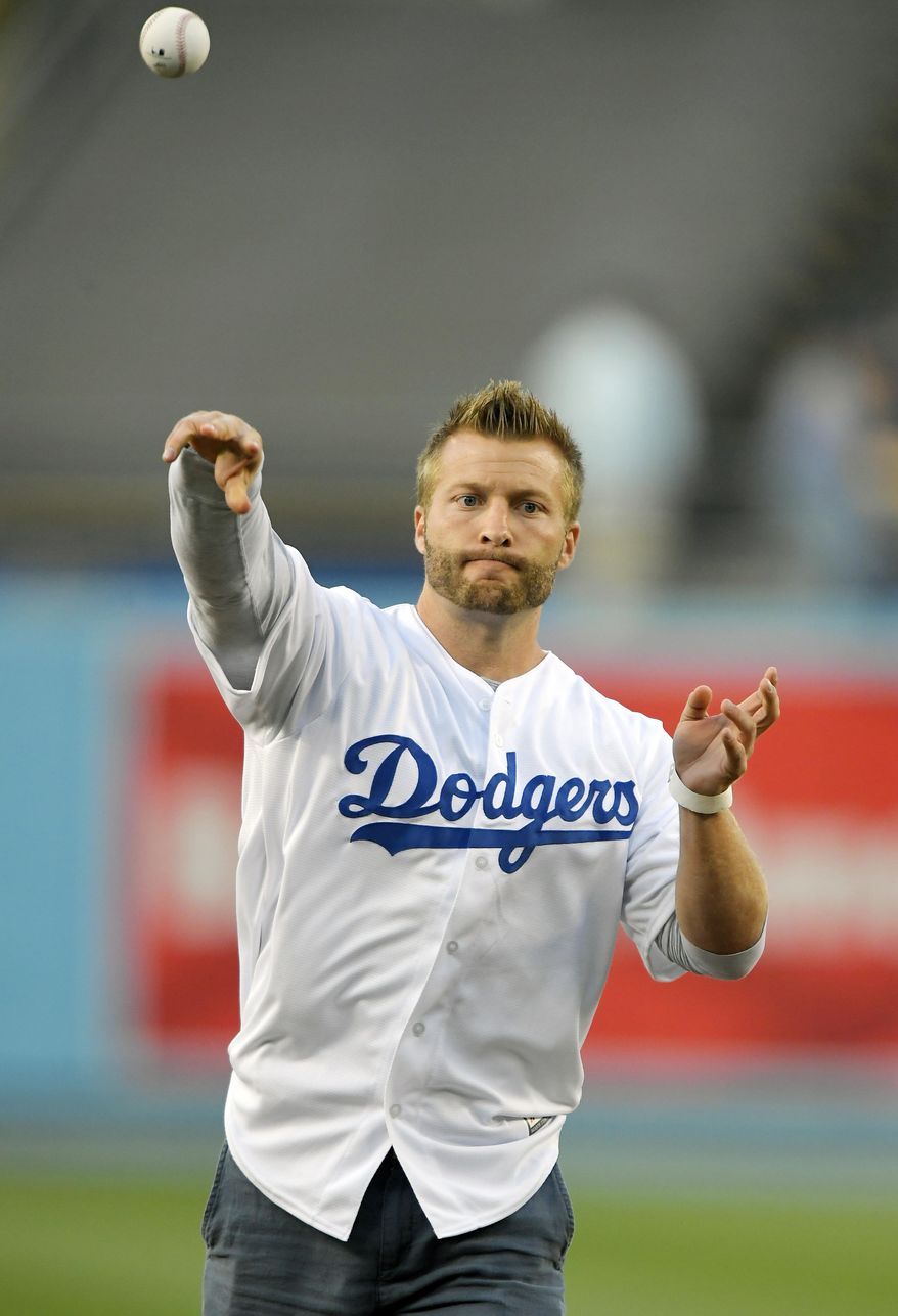 Los Angeles Rams head coach Sean McVay throws out the ceremonial first pitch prior to a baseball game between the Los Angeles Dodgers and the Pittsburgh Pirates, Monday, May 8, 2017, in Los Angeles. (AP Photo/Mark J. Terrill)