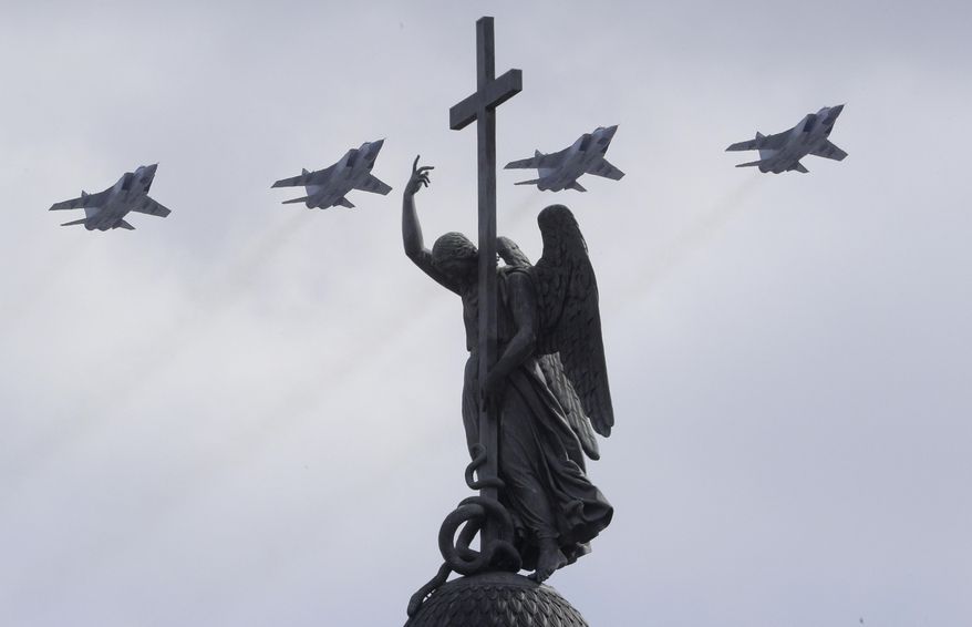 Mikoyan MIG-31, supersonic all-weather long-range jets fly over a statue of an angel fixed atop the Alexander Column during the Victory Day military parade in St. Petersburg, Russia, on Tuesday, May 9, 2017. Victory Day is Russia&#39;s most important secular holiday, commemorating the Red Army&#39;s determination and losses in World War II. (AP Photo/Dmitri Lovetsky)