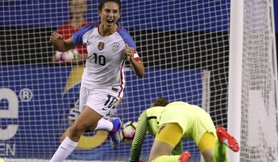 FILE - In this Sunday, Sept. 18, 2016 file photo, USA&#x27;s Carli Lloyd celebrates after beating Netherlands goalkeeper Sari van Veenendaal during an exhibition soccer match, in Atlanta. Manchester City has allowed FIFA Player of the Year Carli Lloyd to miss a domestic league match in England, breaking off from preparations for the FA Cup final, to fly to the Middle East to promote world soccer&#x27;s governing body. Lloyd skipped the game on Tuesday, May 9, 2017 at Bristol City to fly around seven hours to the Gulf, with City granting permission because the game was rescheduled due to the club&#x27;s Champions League progress. (AP Photo/John Bazemore, file)