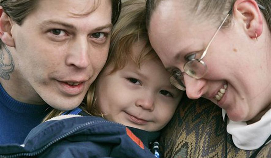 This Tuesday, Dec. 16, 2008 file photo, shows Isidore Heath Campbell, left, his wife, Deborah, and son Adolf Hitler Campbell, 3, in Easton, Pa. On Monday, May 8, 2017, Isidore Heath Campbell officially became Isidore Heath Hitler. He first gained national attention when a supermarket refused to decorate a birthday cake for his son, Adolf Hitler. (AP Photo/Rich Schultz, File)