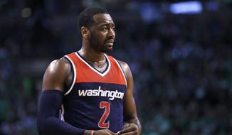 Washington Wizards guard John Wall reacts after a foul during the second quarter in Game 5 of the team&#39;s second-round NBA basketball playoff series against the Boston Celtics in Boston, Wednesday, May 10, 2017. The Celtics won 123-101. (AP Photo/Charles Krupa)