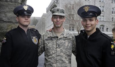 In this Friday April 21, 2017 photo, twin Cadets Cole Ogrydziak, left, and Sumner Ogrydziak, right, and younger brother Cadet Noah Ogrydziak, pose for a photo at the U.S. Military Academy, at West Point, N.Y. The three Texas brothers are set to graduate together from West Point. Noah, Sumner and Cole Ogrydziak will graduate with the U.S. Military Academy’s Class of 2017 on May 27, marking the first time in more than three decades that three siblings have finished at the storied institution at the same time. (AP Photo/Richard Drew)