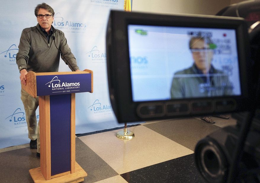 Seen in the screen of a video camera, Energy Secretary Rick Perry talks about the need to address low- and high-level nuclear waste during a news conference in Los Alamos, N.M., on May 10, 2017. Perry toured Los Alamos National Laboratory on Wednesday and was briefed on subjects from nuclear deterrence work to supercomputing projects at the northern New Mexico installation. (AP Photo/Susan Montoya Bryan)