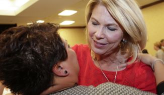 Republican Omaha mayor Jean Stothert, right, hugs a supporter after defeating Democratic mayoral candidate Heath Mello in the contest for mayor, in Omaha, Neb., Tuesday, May 9, 2017. The race has drawn national attention as Democrats seek new energy given huge Republican gains in local, state and federal offices across the country. (AP Photo/Nati Harnik)