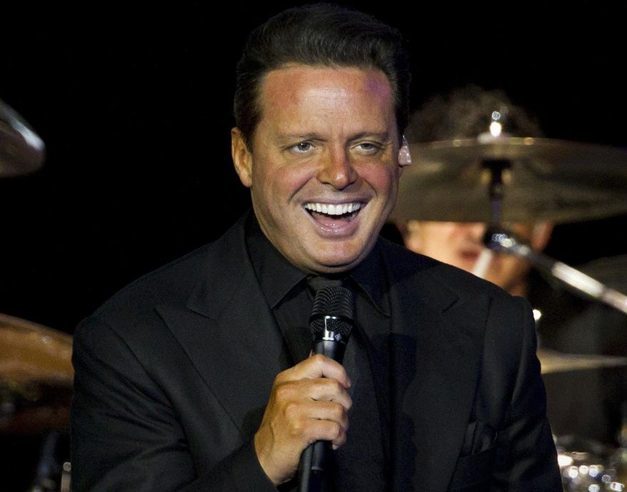 FILE - In this March 11, 2012 file photo, Mexican singer Luis Miguel performs at a concert in Rio de Janeiro, Brazil. Attorneys say Luis Miguel has settled a lawsuit filed by his former manager that led to the Mexican singer’s arrest last week. The Grammy-winning singer was scheduled to appear in a federal court in Los Angeles on Thursday to undergo questioning about his finances and how he should pay a $1 million judgment won by his former manager, William Brockhaus. (AP Photo/Felipe Dana, File)