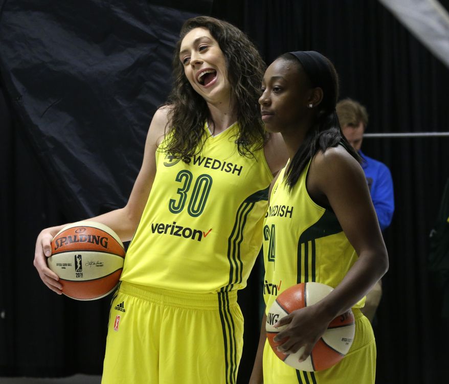 In this photo taken May 2, 2017, Seattle Storm forward Breanna Stewart (30) and guard Jewell Loyd (24) react as they pose for WNBA basketball official photos during the team&#39;s annual media day, Tuesday, May 2, 2017, in Seattle. The whirlwind has stopped for Breanna Stewart. After a much needed break, Stewart is ready for her second season with the Seattle Storm. (AP Photo/Ted S. Warren)