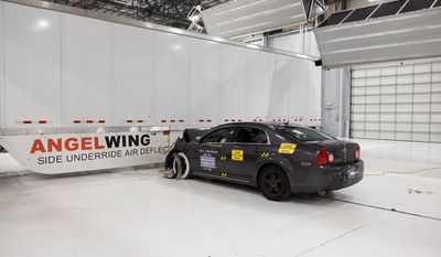 In this April 2017 photo provided by the Insurance Institute for Highway Safety, during a 35 mph crash test, a steel and fiberglass underride guard prevents a car from going underneath a tractor-trailer. Federal law requires big trucks to have rear underride guards, which stop cars from traveling underneath the truck in an accident. But the government doesn’t require side guards. The Insurance Institute for Highway Safety says side guards could prevent hundreds of traffic deaths per year. (Insurance Institute for Highway Safety via AP)