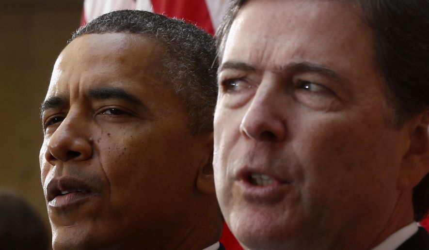 In this Oct. 28, 2013, file photo, President Barack Obama and FBI Director James Comey participate in the installation ceremony for Comey as FBI director, at FBI Headquarters in Washington. President Donald Trump abruptly fired Comey on May 9, 2017, dramatically ousting the nation's top law enforcement official in the midst of an FBI investigation into whether Trump's campaign had ties to Russia's election meddling. (AP Photo/Charles Dharapak, File)