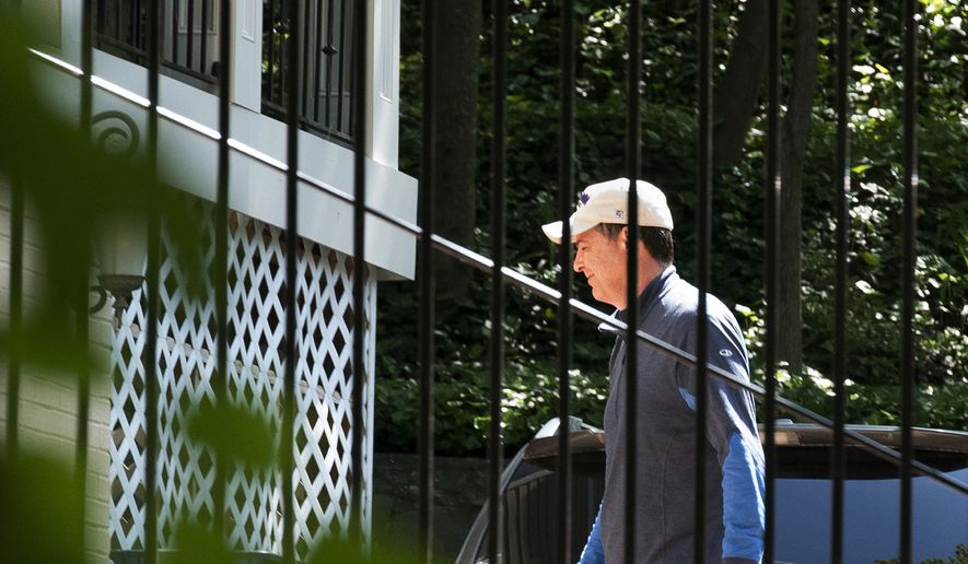Former FBI Director James Comey walks at his home in McLean, Va., Wednesday, May 10, 2017. President Donald Trump fired Comey on Tuesday, ousting the nation&#39;s top law enforcement official in the midst of an investigation into whether Trump&#39;s campaign had ties to Russia&#39;s election meddling. (AP Photo/Sait Serkan Gurbuz)