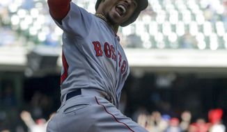 Boston Red Sox&#39;s Mookie Betts reacts as he rounds first after hitting a three-run home run during the ninth inning of a baseball game against the Milwaukee Brewers Thursday, May 11, 2017, in Milwaukee. (AP Photo/Morry Gash)