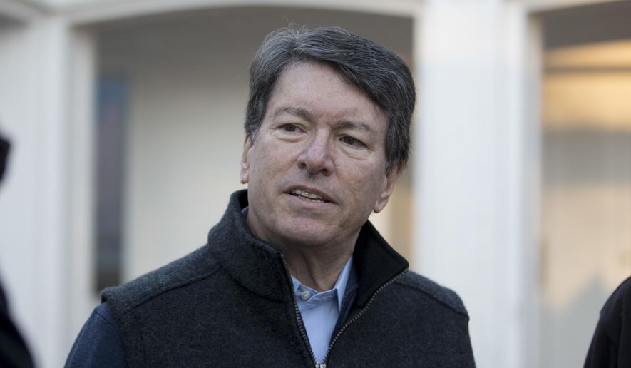 In this photo taken Nov. 8, 2016, then-New York's 19th Congressional District Republican candidate, now-Rep. John Faso, R-N.Y., talks with media members after voting in Kinderhook, N.Y. On the job little more than four months, Faso is facing a political firestorm in his own backyard that threatens to consume his first term in Congress just as it begins.  (AP Photo/Mike Groll, File)