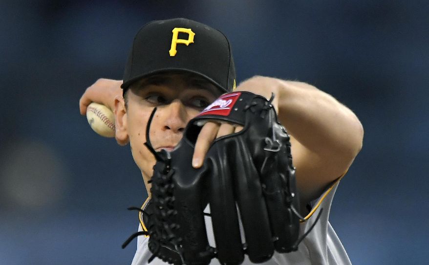 Pittsburgh Pirates starting pitcher Chad Kuhl winds up during the first inning of the team's baseball game against the Los Angeles Dodgers, Wednesday, May 10, 2017, in Los Angeles. (AP Photo/Mark J. Terrill)