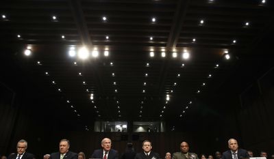 From left, acting FBI Director Andrew McCabe, CIA Director Mike Pompeo, Director of National Intelligence Dan Coats, National Security Agency Director Adm. Michael Rogers, Defense Intelligence Agency Director Lt. Gen. Vincent Stewart, and National Geospatial-Intelligence Agency (NGA) Director Robert Cardillo, prepare to testify on Capitol Hill in Washington, Thursday, May 11, 2017, before the Senate Intelligence Committee hearing on major threats facing the U.S. (AP Photo/Jacquelyn Martin)