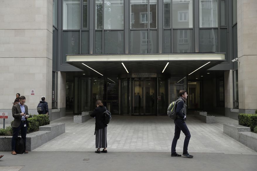 An exterior view shows the main entrance of St Bartholomew's Hospital, in London, one of the hospitals whose computer systems were affected by a cyberattack, Friday, May 12, 2017. A large cyberattack crippled computer systems at hospitals across England on Friday, with appointments canceled, phone lines down and patients turned away. (AP Photo/Matt Dunham)