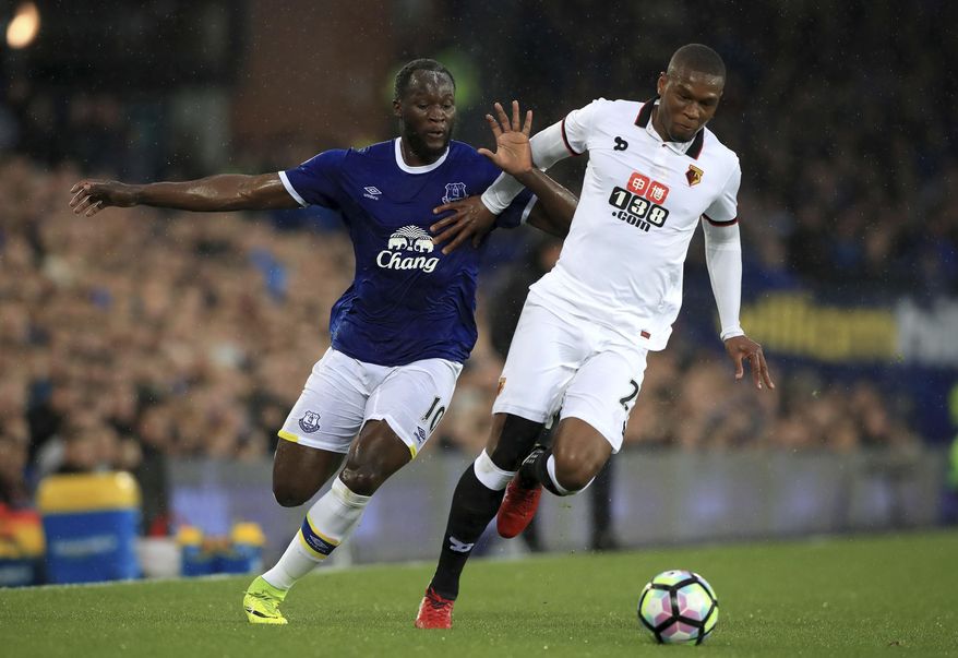 Everton's Romelu Lukaku, left, and Watford's Christian Kabasele in action during the English Premier League soccer match at Goodison Park in Liverpool, England, Friday May 12, 2017. (Peter Byrne/PA via AP)
