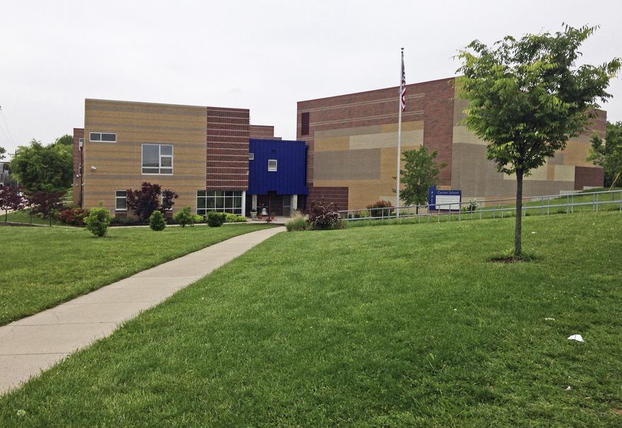 This Friday, May 12, 2017, photo shows the Carson School, an elementary school in Cincinnati. Gabriel Taye, an 8-year-old boy, killed himself in January 2017 two days after being knocked unconscious by another Carson School student, and Cincinnati Public Schools released a 24-minute surveillance video Friday, May 12, 2017, that appears to show Gabriel trying to shake the hand of a boy who had hit another child, before collapsing to the floor after being pushed into a wall at the entrance of a boys' bathroom. (AP Photo/Lisa Cornwell)