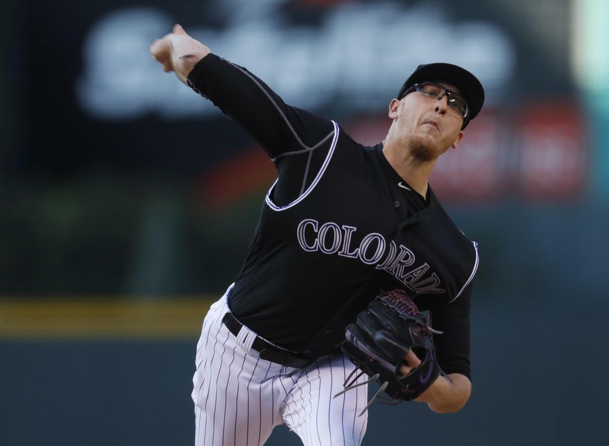 Colorado Rockies starting pitcher Jeff Hoffman delivers a pitch to a Los Angeles Dodgers batter during the first inning of a baseball game Thursday, May 11, 2017, in Denver. (AP Photo/David Zalubowski)