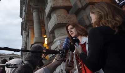 Michelina Suriano, one of the lawyers representing the victims of the Costa Concordia shipwreck, meets the media outside the Court of Cassation in Rome, Friday, May 12, 2017. The Italian captain of the Costa Concordia cruise liner that crashed into a reef in 2012, killing 32 people, was headed to a Rome prison after losing his final appeals bid.  The Court of Cassation, Italy’s highest criminal tribunal, in a ruling Friday evening, upheld Francesco Schettino’s lower court convictions and his 16-year prison sentence. (AP Photo/Gregorio Borgia)