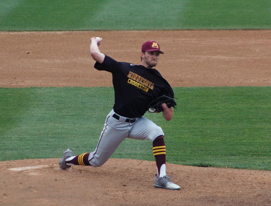 University of Minnesota-Crookston pitcher Parker Hanson throws against Minnesota State in St. Cloud, Minn., Wednesday, May 10, 2017. Hanson’s success could be measured in his 90-mph fastball, his nasty slider or his start that vaulted his college baseball team into the playoffs. Or it could be marked by what he’s missing. Hanson was born without a left hand, but found a way to adapt at a young age so he could pitch, field, bat and play the game he loved. (AP Photo/Jeff Baenen)