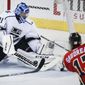 FILE - In this Feb. 28, 2017, file photo, Los Angeles Kings goalie Ben Bishop, left, stops a shot from Calgary Flames&#x27; Johnny Gaudreau during second period NHL hockey action in Calgary, Alberta. The Dallas Stars have signed Bishop to a six-year, $29.5-million deal. General manager Jim Nill announced the terms Friday, May 12, 2017, less than a week after acquiring rights to the 30-year-old Bishop from the Los Angeles Kings for a fourth-round pick in next month&#x27;s draft. The 6-foot-7 Bishop played just seven games after the Kings acquired him from Tampa Bay.  (Jeff McIntosh/The Canadian Press via AP, File)