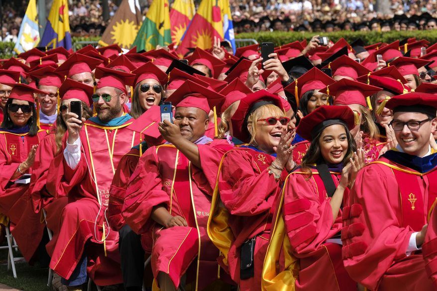 Students from the University of Southern California's Class of 2017 react during the commencement address by actor Will Ferrell during USC's 134th commencement ceremony in Los Angeles on Friday, May 12, 2017. (AP Photo/Richard Vogel)
