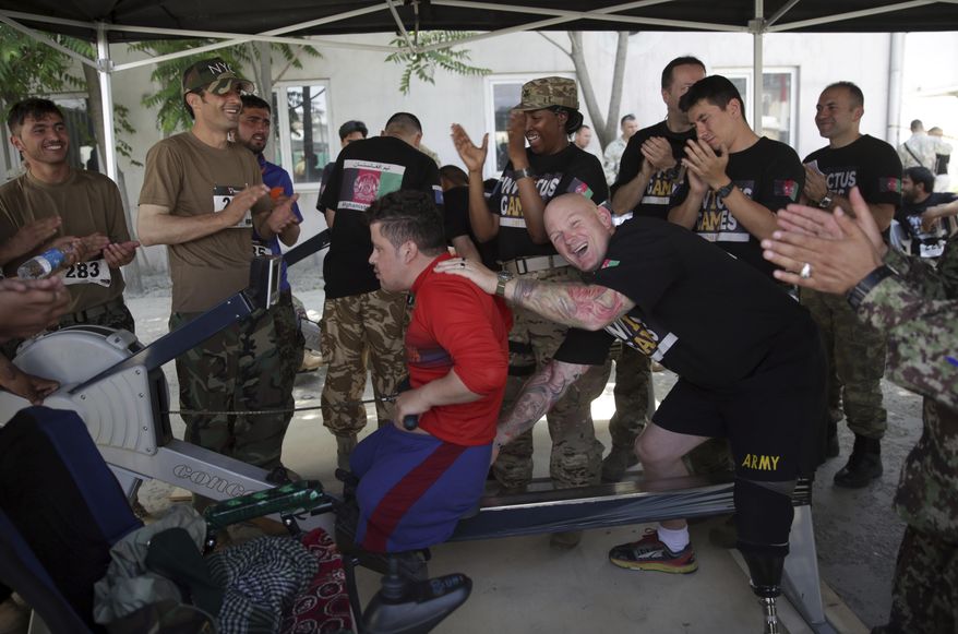 A wounded member of Afghanistan's National Security Forces takes part in trials for "Invictus Games" at the Resolute Support Headquarter, in Kabul, Afghanistan, Saturday, May 13 , 2017. NATO Afghanistan mission hosted a selection event Saturday for seven openings on the Afghan forces wounded warriors' team that will compete against soldiers and veterans from 17 countries in Toronto. (AP Photos/Massoud Hossaini)