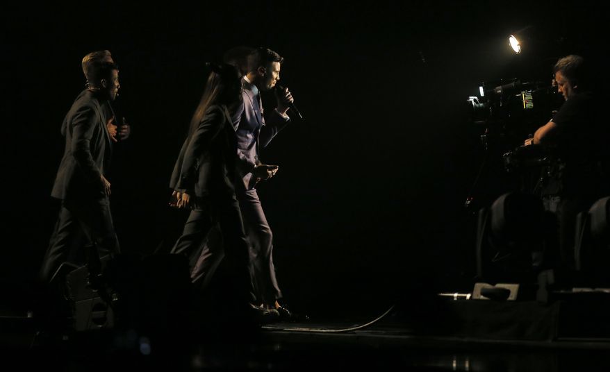 Robin Bengtsson from Sweden, center, performs the song "I Can't Go On"during the Final for the Eurovision Song Contest, in Kiev, Ukraine, Saturday, May 13, 2017. (AP Photo/Efrem Lukatsky)