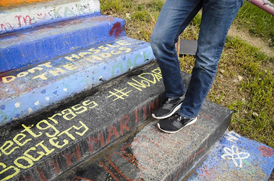 Members of the Sweetgrass Society were allowed to repaint a step on the campus "Hello Walk," seen Monday, May 8, 2017. The step was painted over last year after a controversy over the #NoDAPL hashtag, which is a sign of opposition to the Dakota Access Pipeline in North Dakota. (Holly Michels/The Billings Gazette via AP)