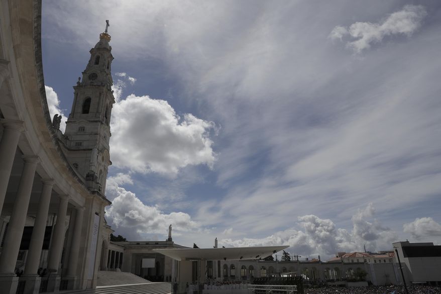 Faithful gather at the Sanctuary of Our Lady of Fatima during a mass celebrated by Pope Francis in Fatima, Portugal, Saturday, May 13, 2017. The pontiff canonized on Saturday two poor, illiterate shepherd children whose visions of the Virgin Mary 100 years ago marked one of the most important events of the 20th-century Catholic Church. (AP Photo/Alessandra Tarantino)