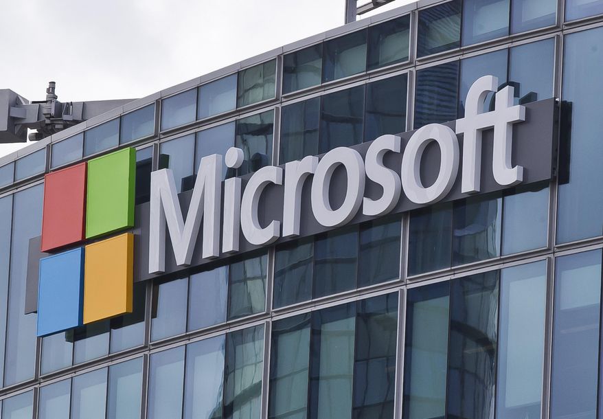 FILE - This April 12, 2016 file photo shows the Microsoft logo in Issy-les-Moulineaux, outside Paris, France.  The cyberextortion attack hitting dozens of countries was a “perfect storm” of sorts. It combined a known and highly dangerous security hole in Microsoft Windows, tardy users who didn’t apply Microsoft’s March software fix, and a software design that allowed the malware to spread quickly once inside university, business and government networks. (AP Photo/Michel Euler, File)