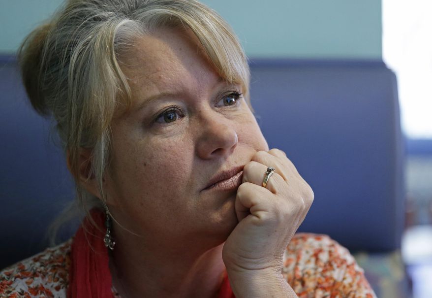In this April 27, 2017 photo, Susan Jones pauses as she talks about her husband, Martin Jones, while sitting in a restaurant in Long Beach, Wash. Martin Jones was convicted in the Feb. 13, 2010 shooting of Scott Johnson ,then a Washington state trooper, in Long Beach, but his attorneys are now seeking a new trial. Johnson is now the Pacific County Sheriff. (AP Photo/Ted S. Warren)