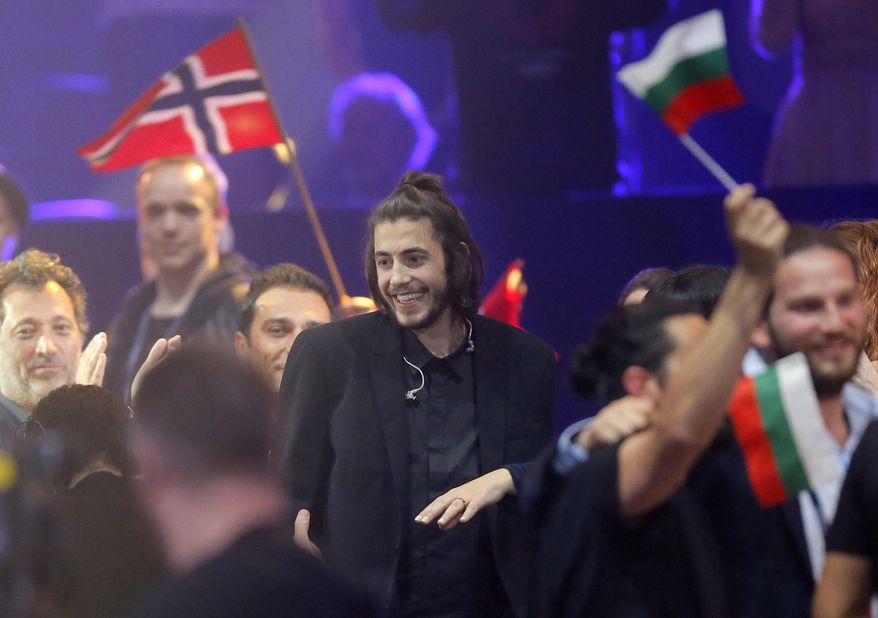 Salvador Sobral from Portugal reacts after winning the Final of the Eurovision Song Contest with his song "Amar pelos dois", in Kiev, Ukraine, Saturday, May 13, 2017. (AP Photo/Efrem Lukatsky)